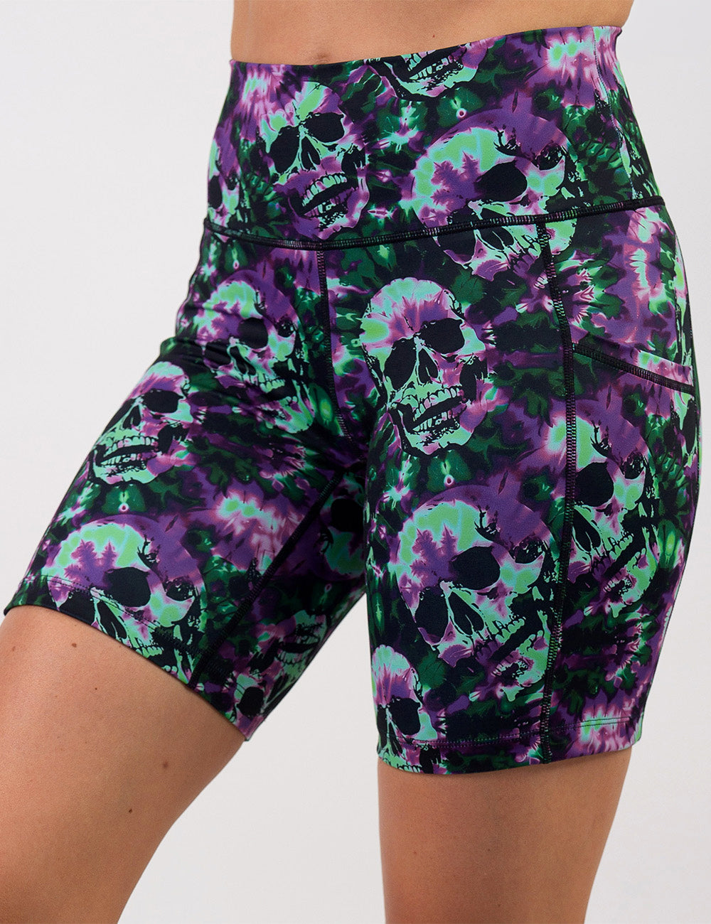 front of the 7 inch purple and green tie dye skulls shorts against a white background