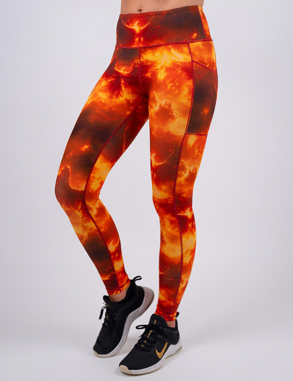 front of the full length phoenix surrounded by fire leggings against a white background