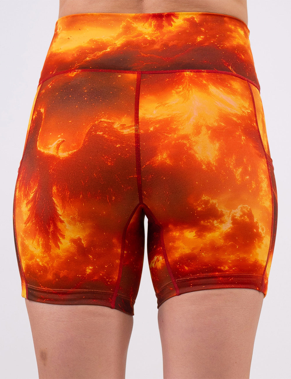 back of the 5 inch phoenix surrounded by fire shorts against a white background