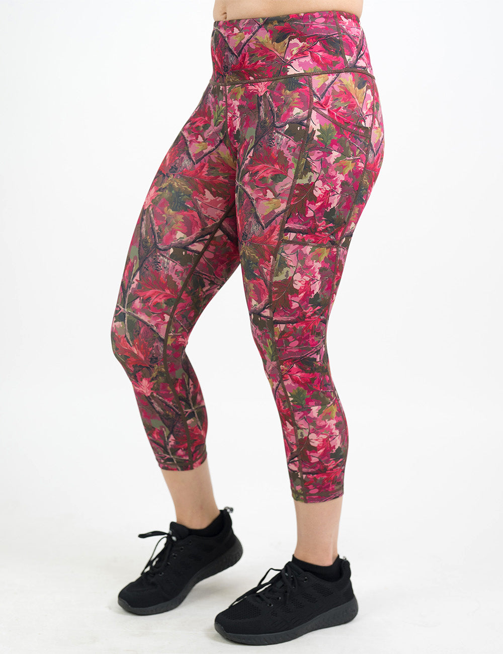 front of the capri pink forest camo leggings against a white background