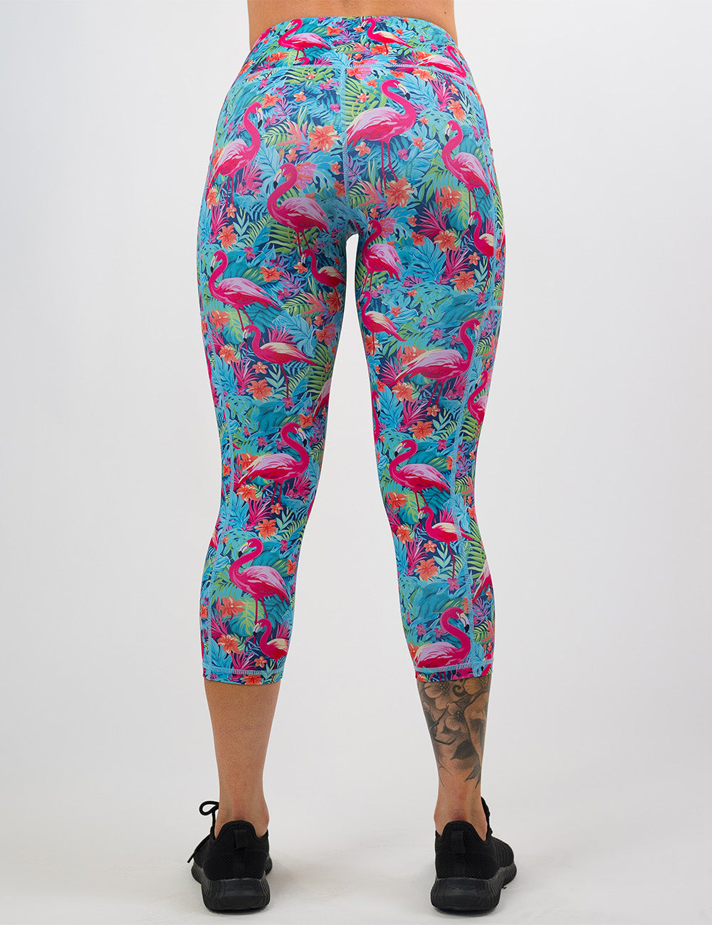back of the colorful flamingo leggings against a white background