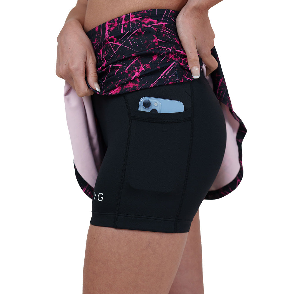 shorts underneath the pink paint splatter patterned skirt