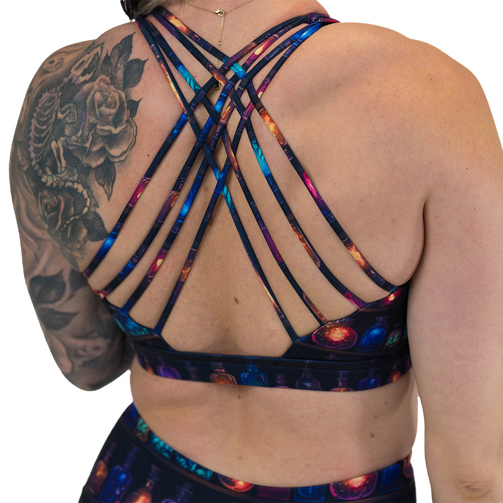 back of the potions patterned sports bra