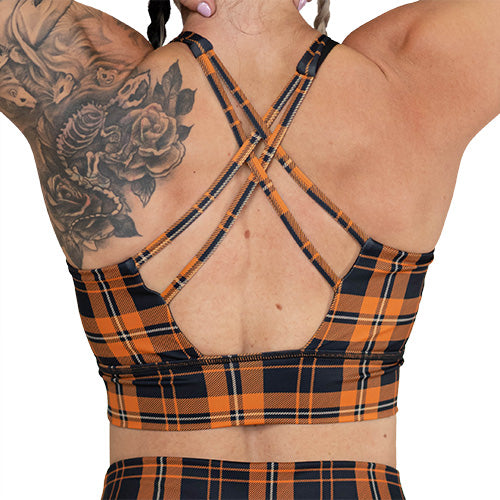 back of the orange and black plaid sports bra
