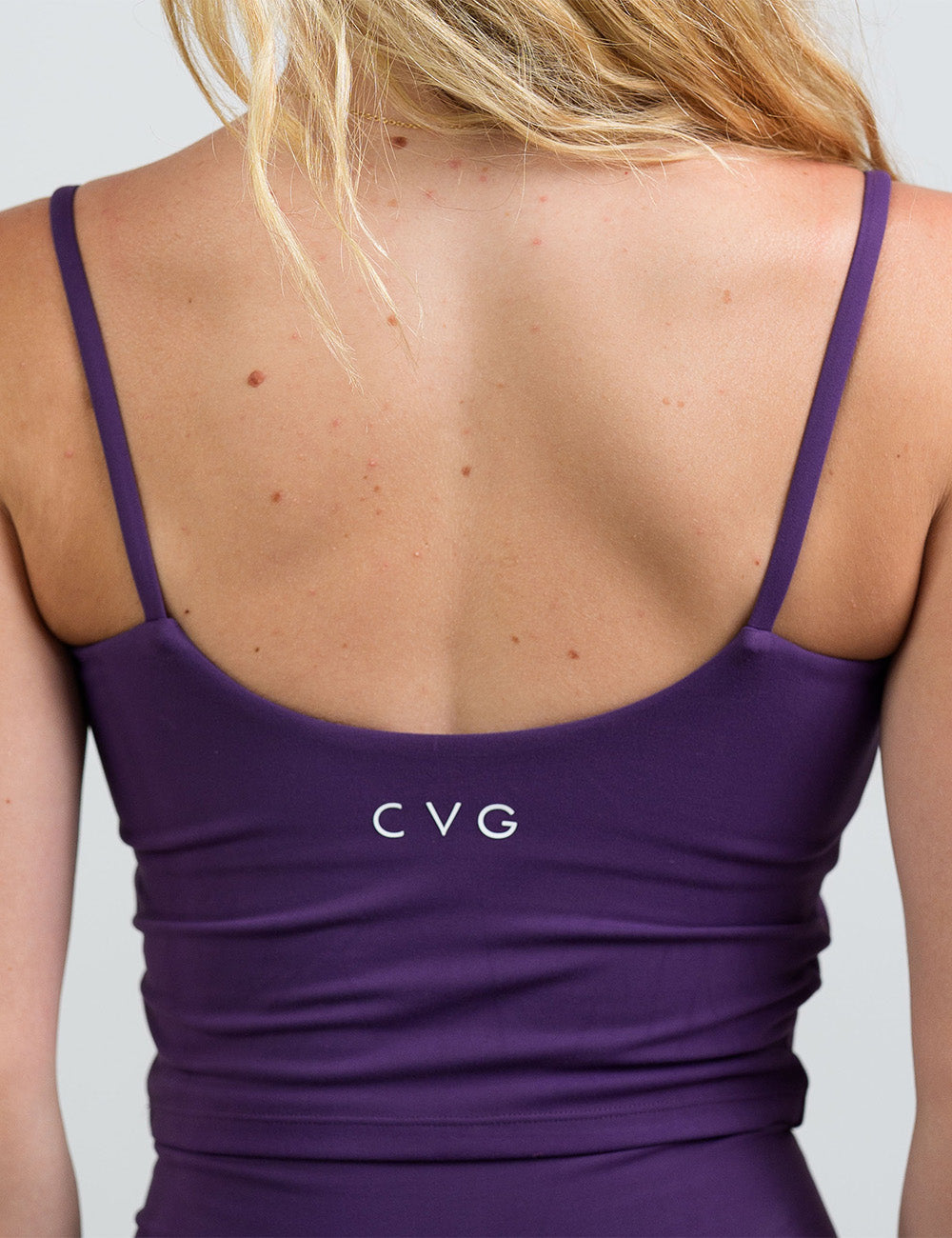 back of the purple cami top against a white background