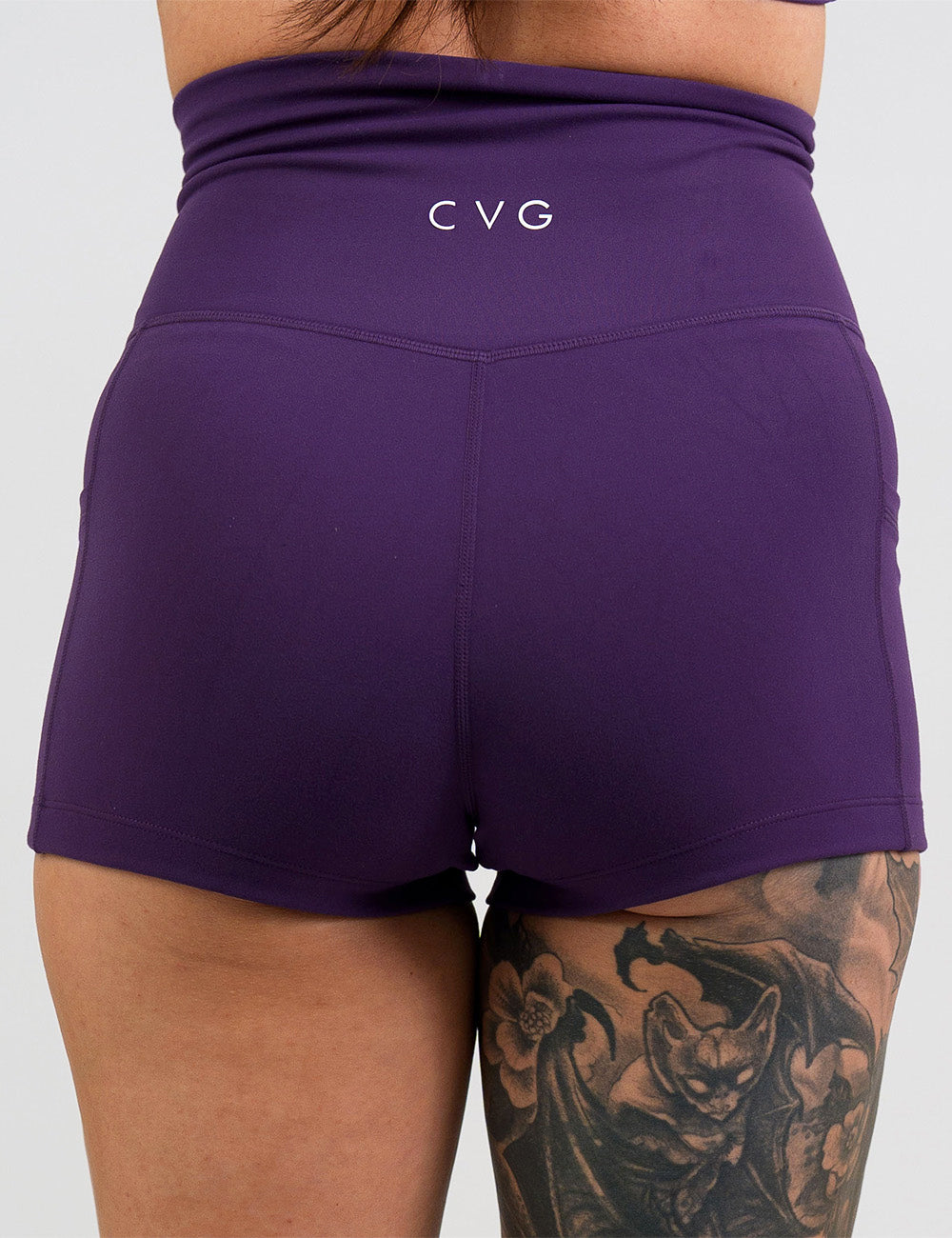 back of the 2.5 inch solid purple shorts against a white background