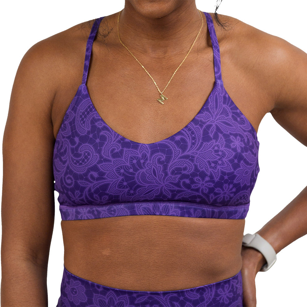 front of purple flower artwork move free bra against a white background