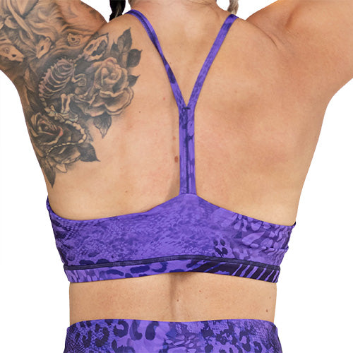 back of purple animal print sports bra