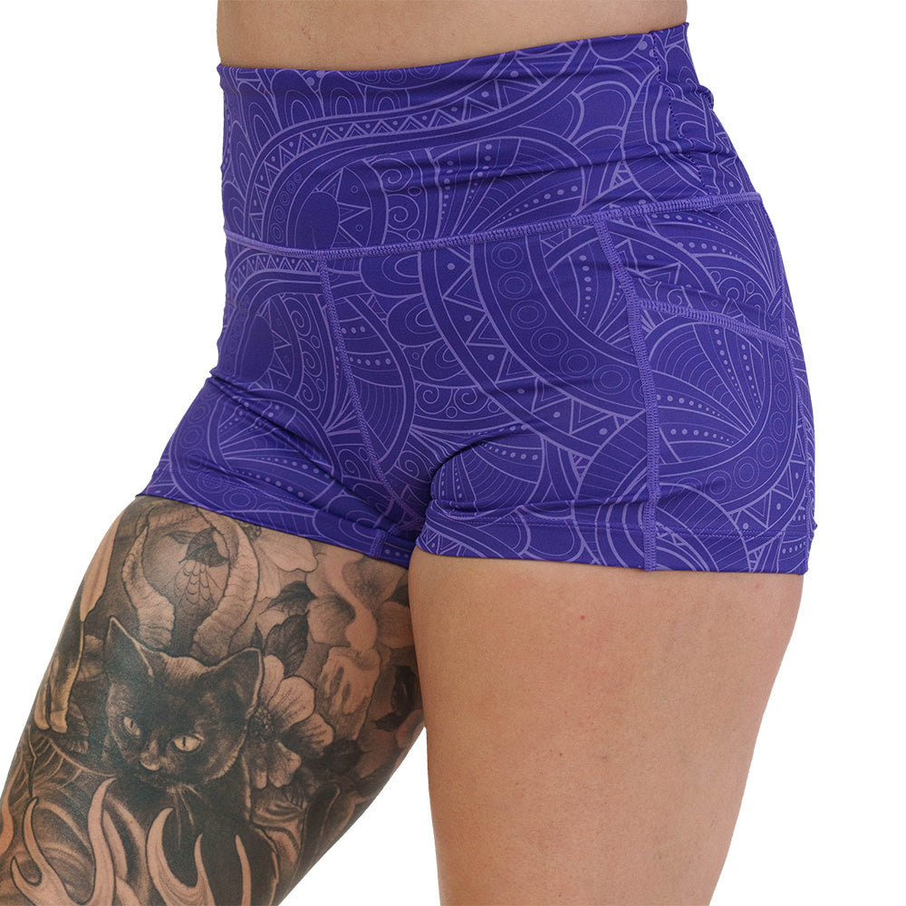 purple shorts with a spiral design