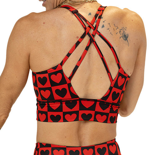 back of black and red heart pattern sports bra