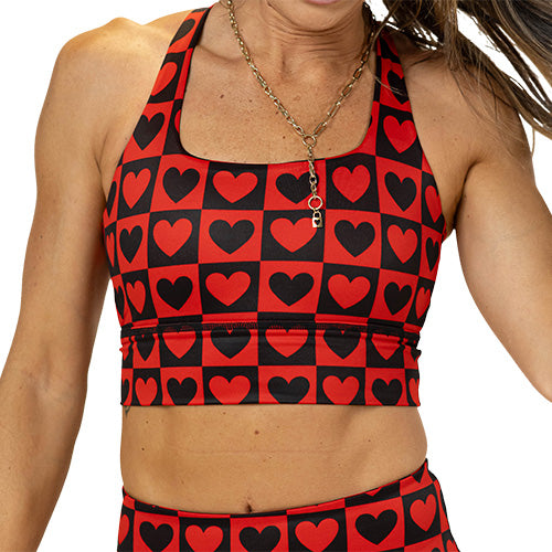 front of black and red heart pattern sports bra