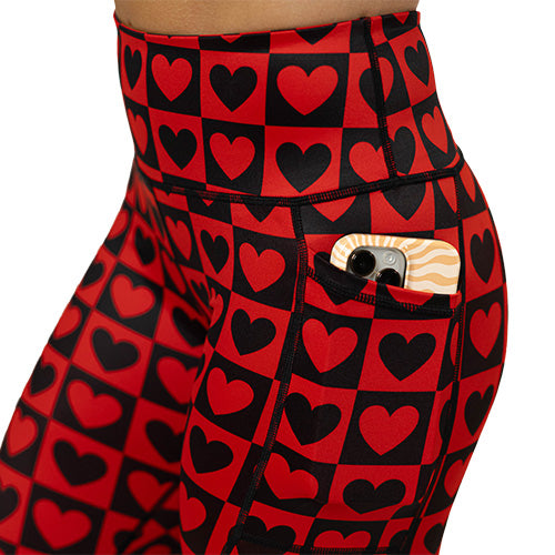 side pocket of the black and red heart pattern leggings