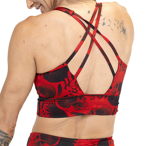 back of red and black raven and skull print sports bra