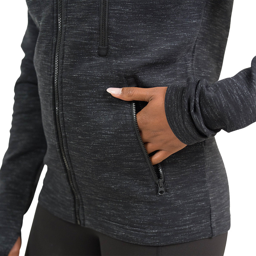 close up of the charcoal rest day zip up with a hand in the pocket against white background