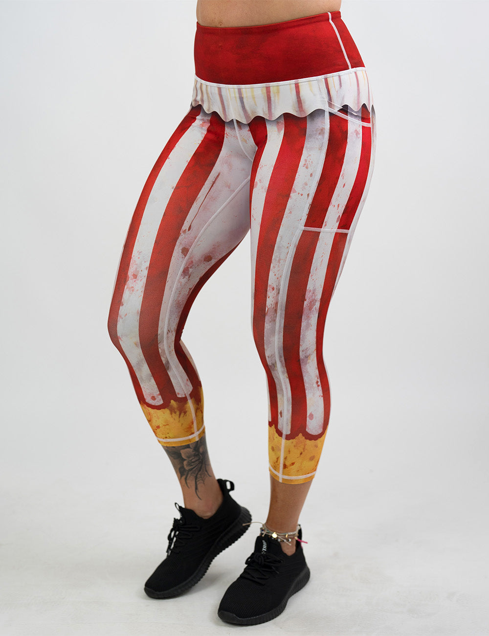 front of the bloody red and white stripes circus capri leggings against a white background