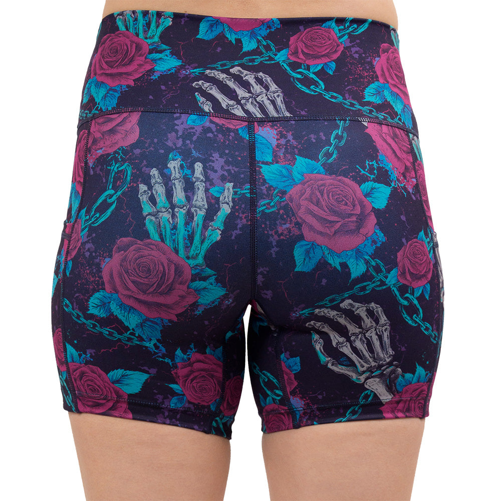 back of the 5 inch roses and skeleton hands connected by chain links pattern shorts against a white background