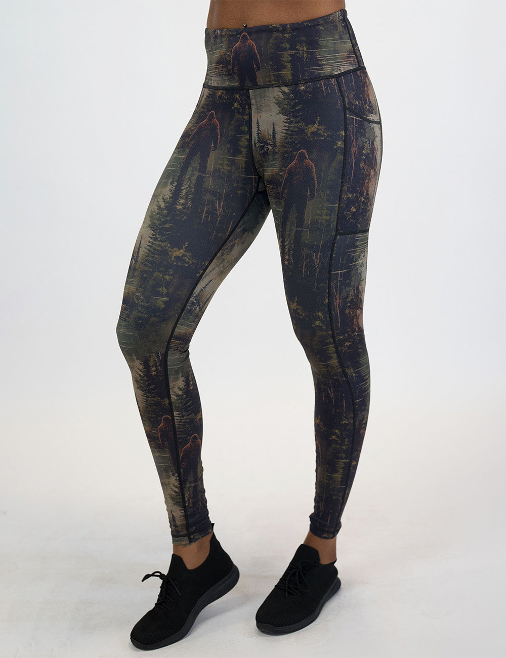 front of the bigfoot in a forest full length leggings against a white background