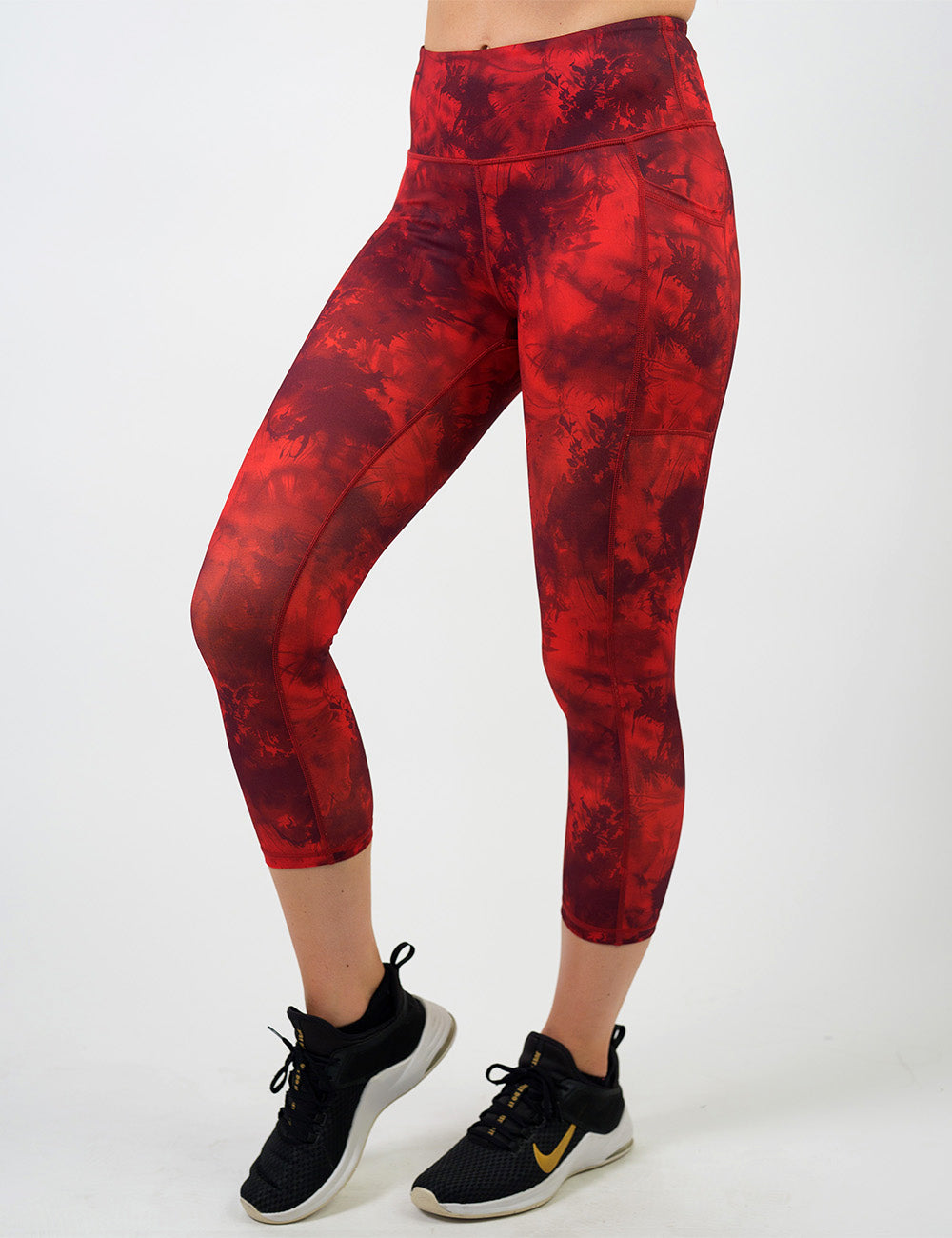 front of the dark red tie dye capri leggings against a white background