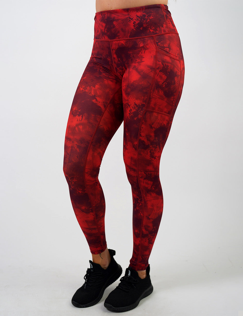 front of the dark red tie dye full length leggings against a white background