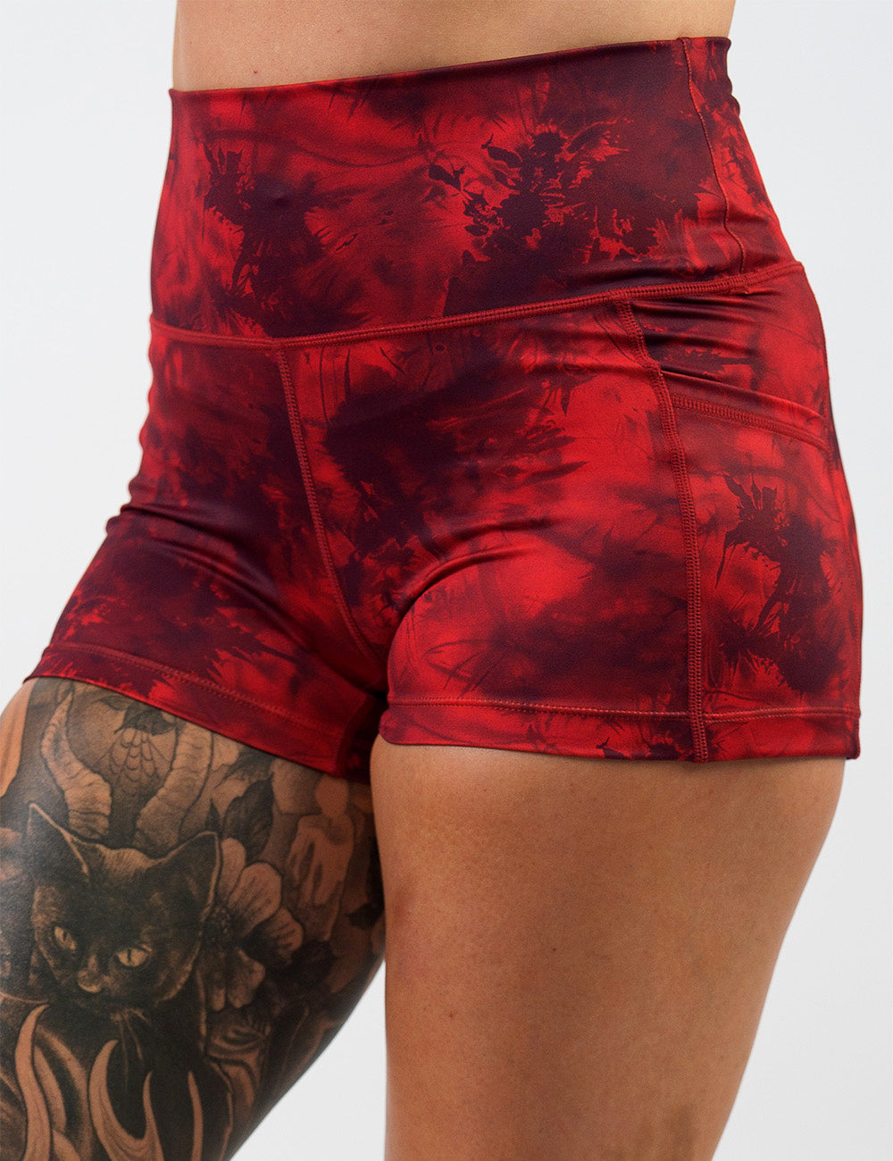 front of the 2.5 inch red tie dye shorts against a white background