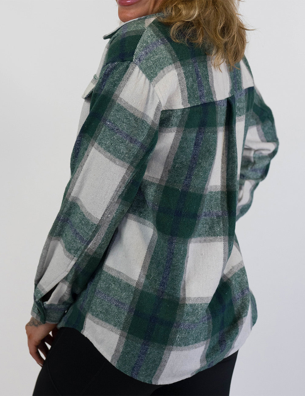 back of the green plaid shacket against a white background
