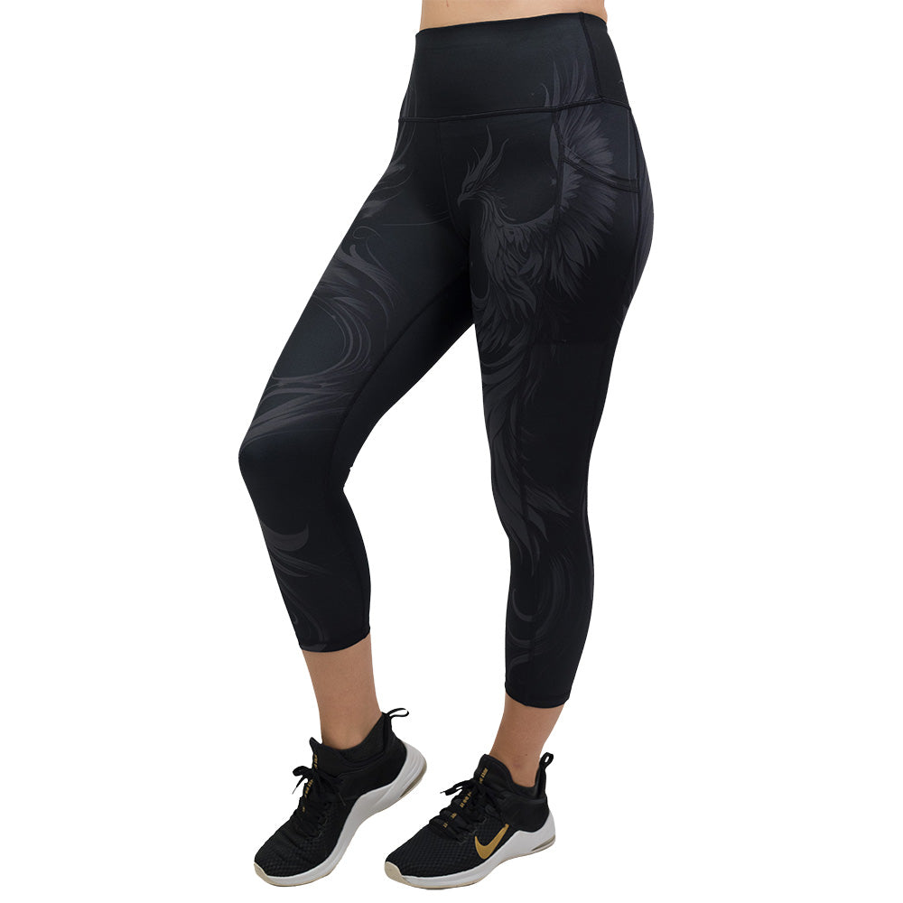 Black leggings with a phoenix design on them