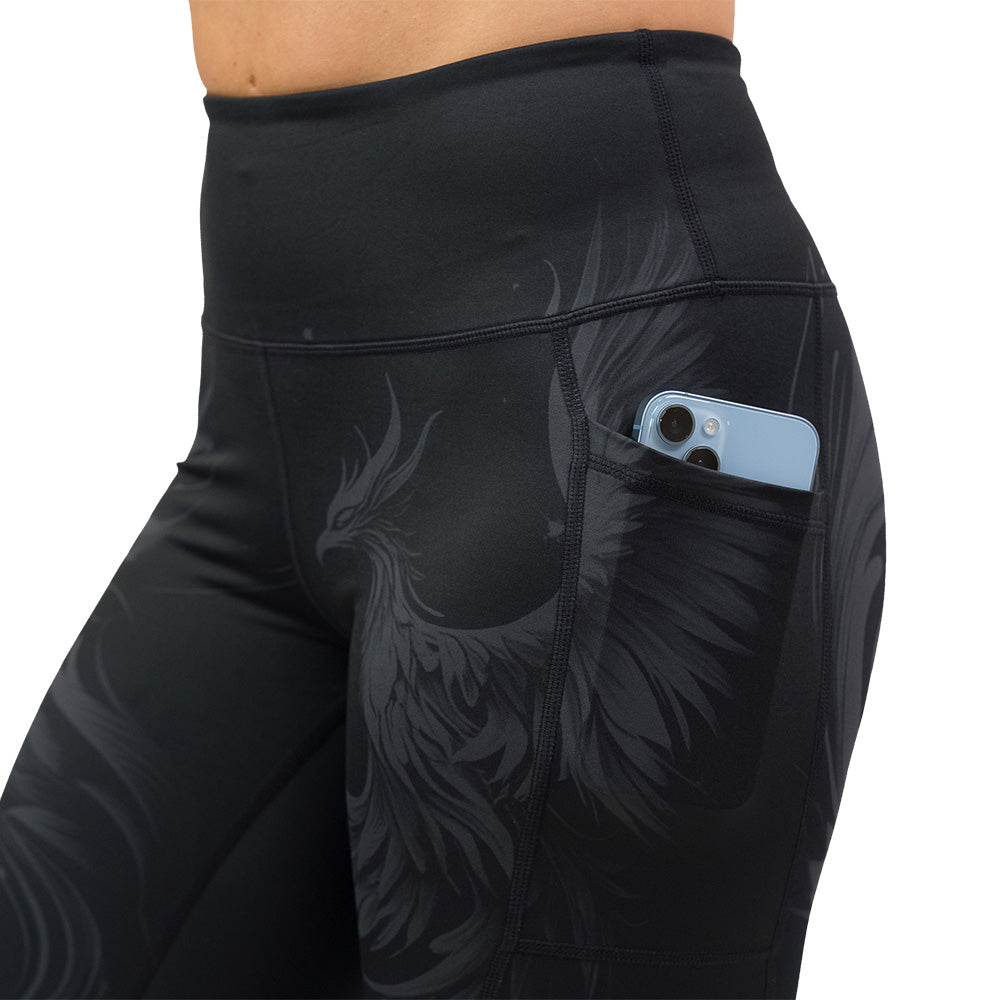 Black leggings with a phoenix design on them
