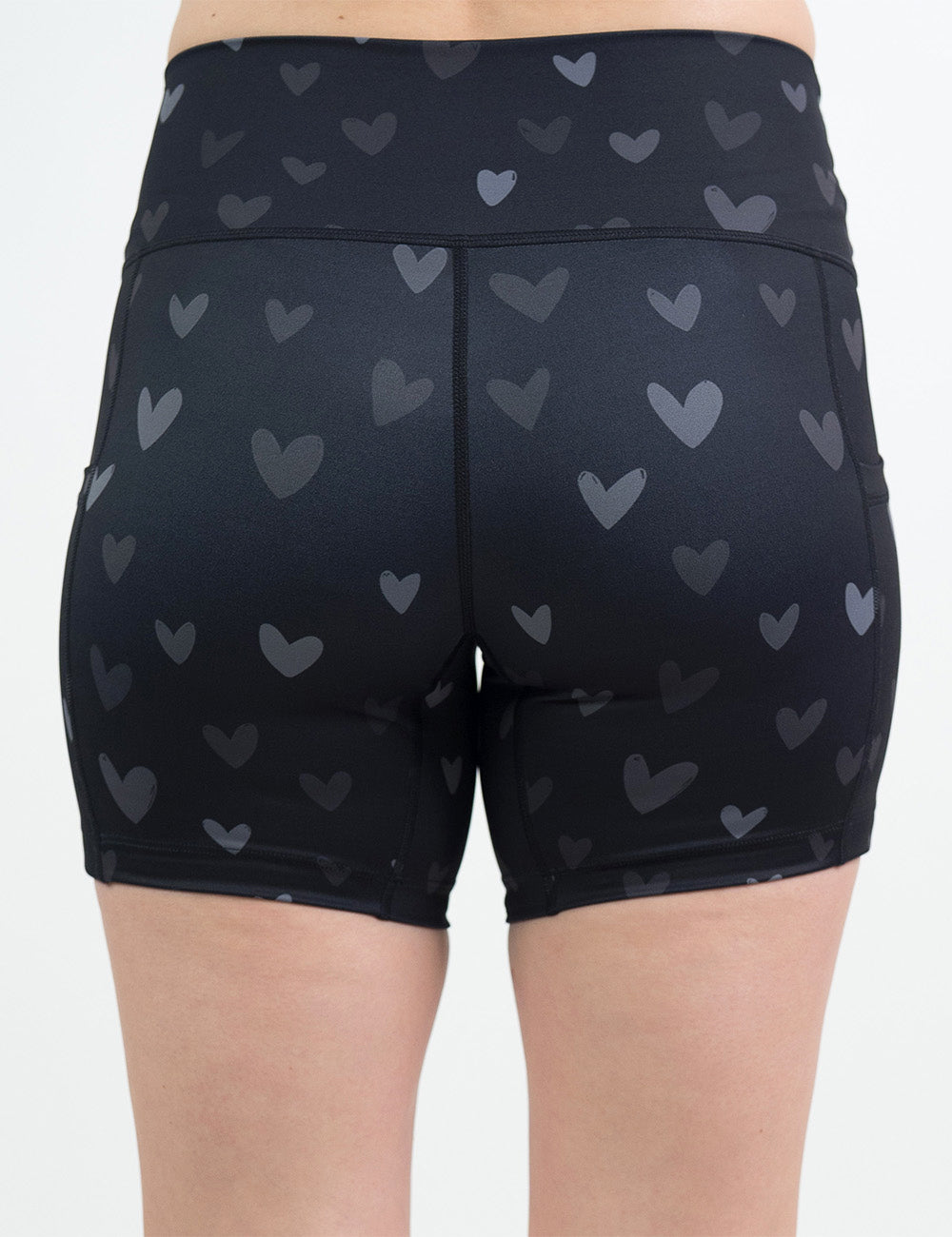 back of the 5 inch black shorts with light and dark grey hearts against a white background