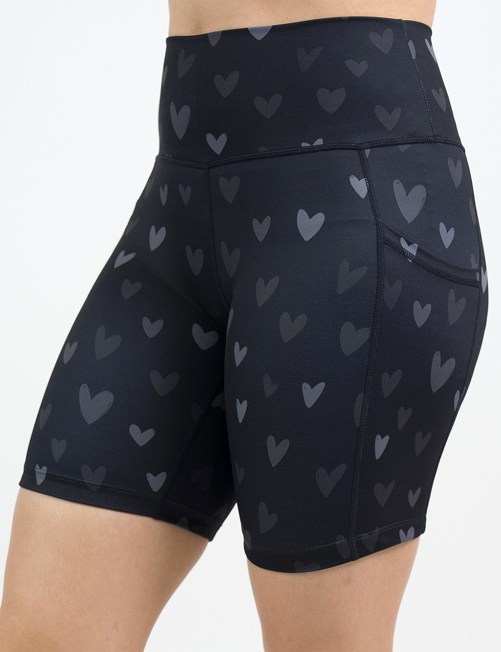 front of the 7 inch black shorts with light and dark grey hearts against a white background