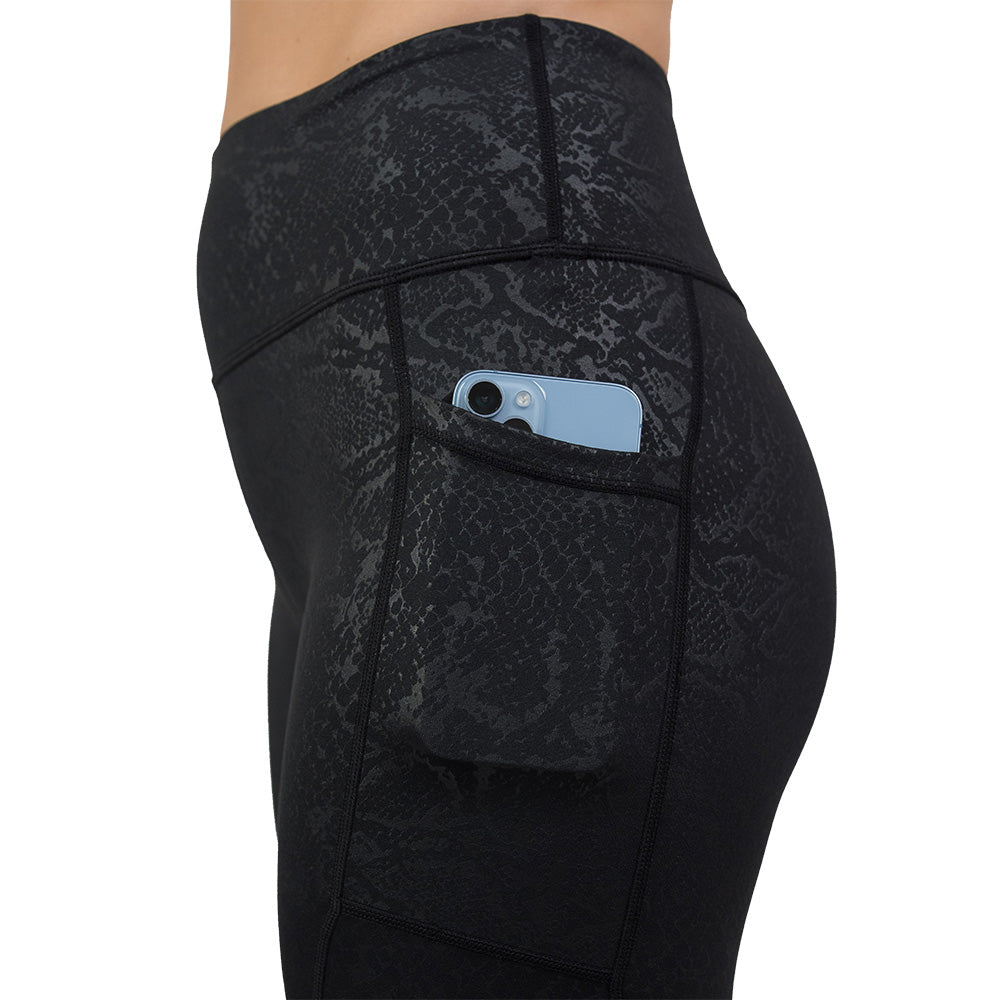 close up of shadow python leggings with phone in pocket
