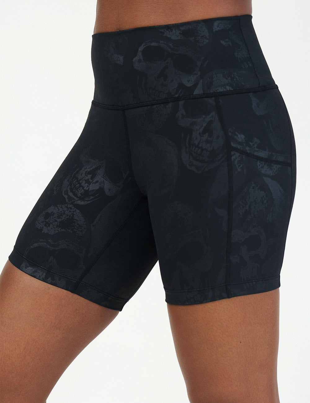 front of the 5 inch black shorts with a dark grey skull pattern against a white background