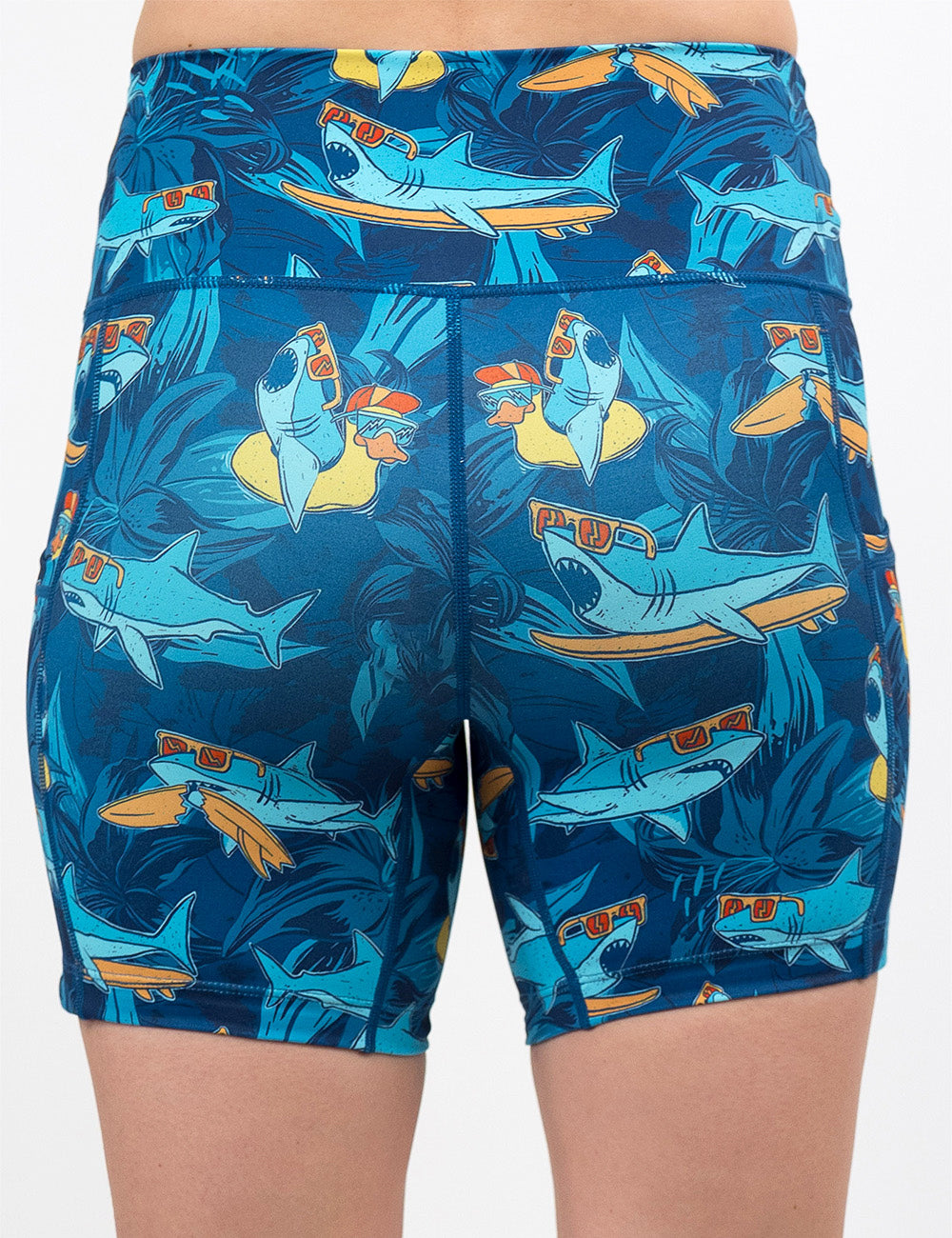 back of the 5 inch cartoon sharks surfboarding with sunglasses shorts against a white background