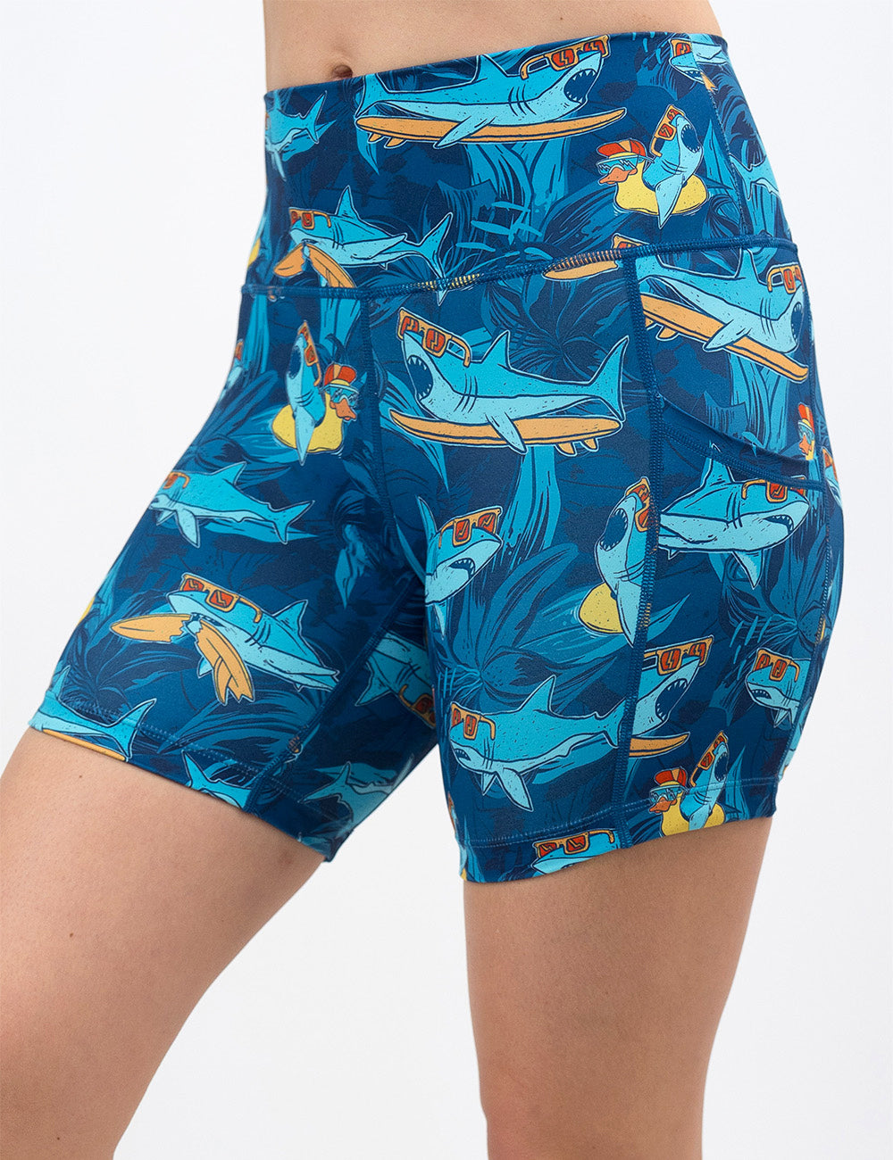 front of the 5 inch cartoon sharks surfboarding with sunglasses shorts against a white background