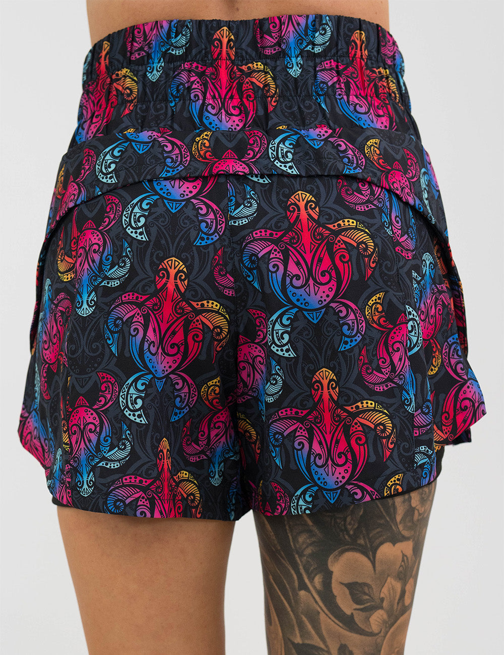 back of the 5.5 inch rainbow turtle day dream shorts against a white background