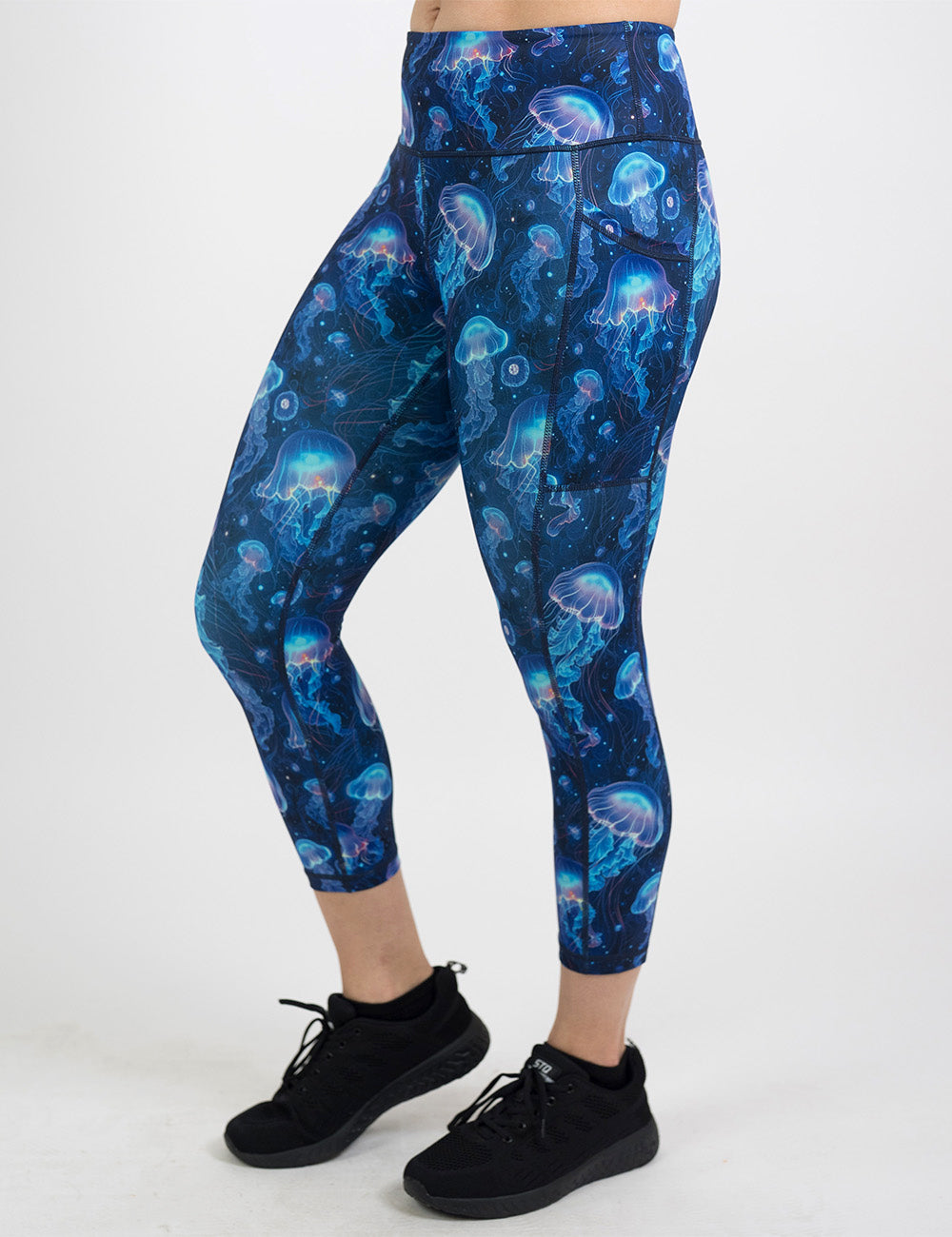 front of the capri blue jelly fish pattern leggings against a white background