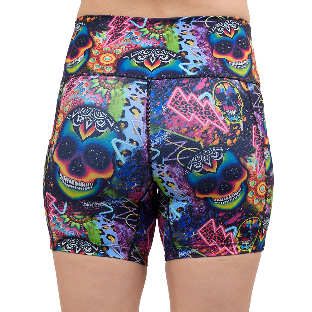 back of the the brightly colored psychedelic skulls pattern against a busy background full of designs 5 inch shorts against a white background