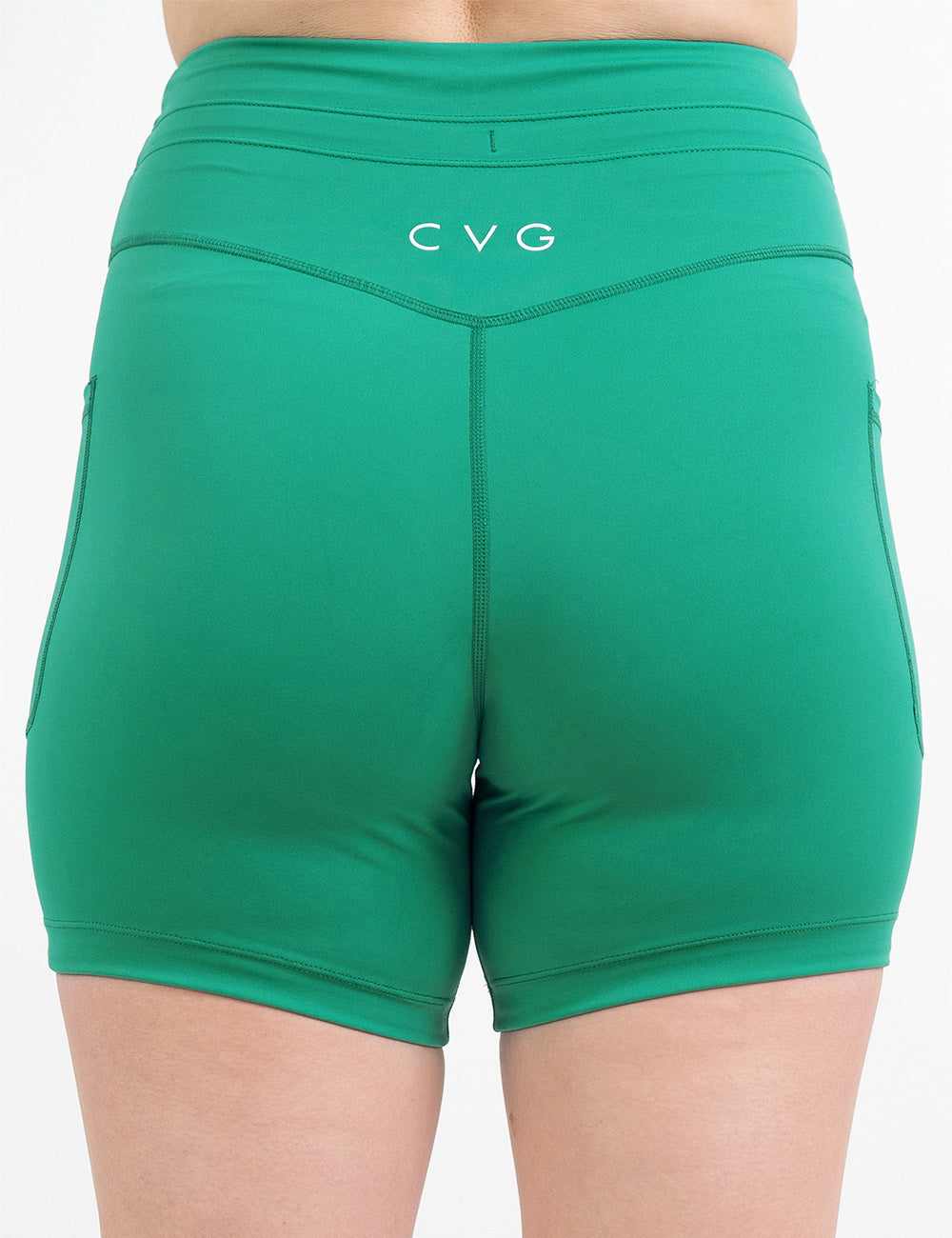 back of the 5 inch green omni style shorts against a white background