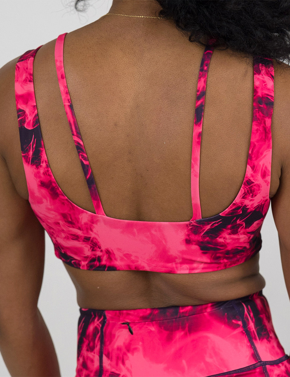 back of the pink smoke show vista bra against a white background