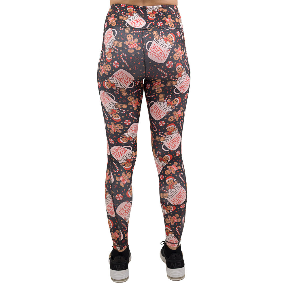 back of the Christmas-themed leggings with gingerbread men and candy canes