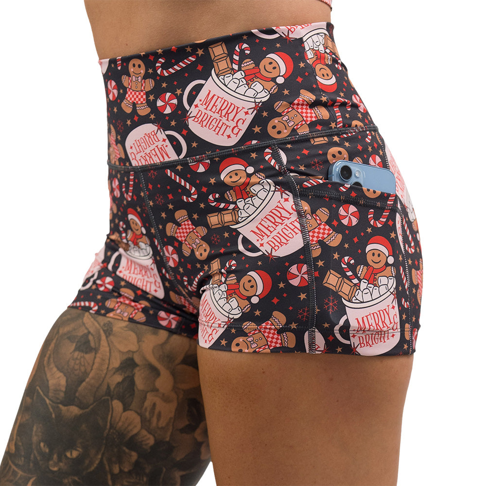 Christmas-themed shorts with gingerbread men and candy canes