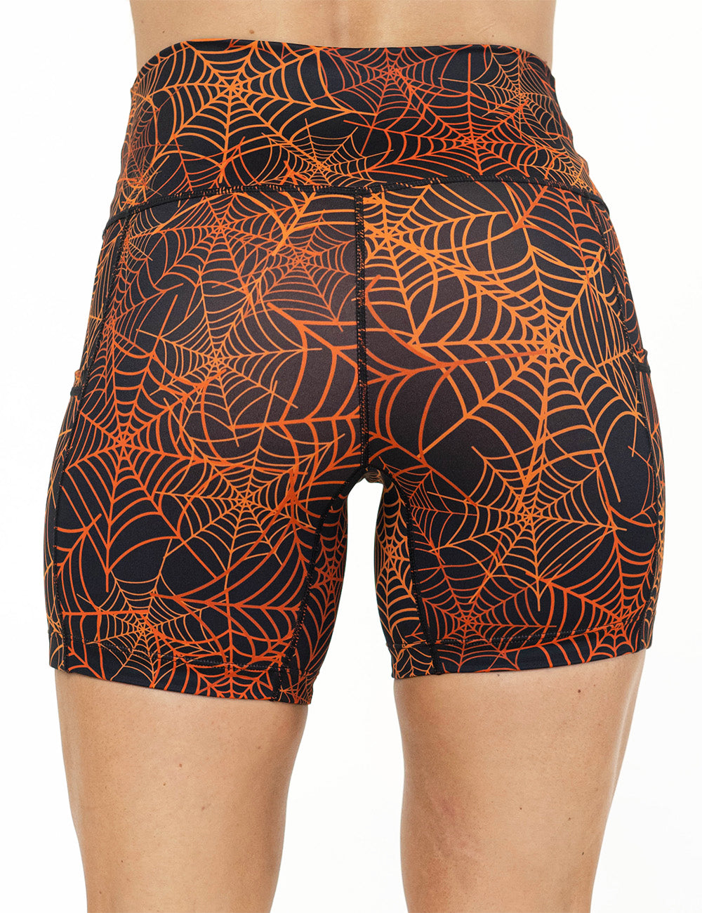 back of the 5 inch orange spider webs against a black background shorts against a white background