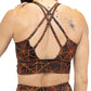 back of black and orange spider web sports bra