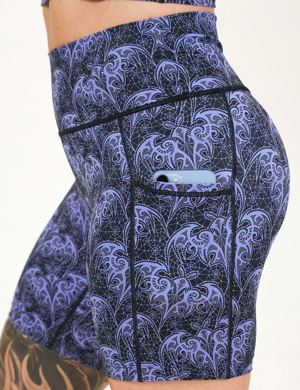 close up of the 7 inch purple bat lace shorts with a phone in it pocket
