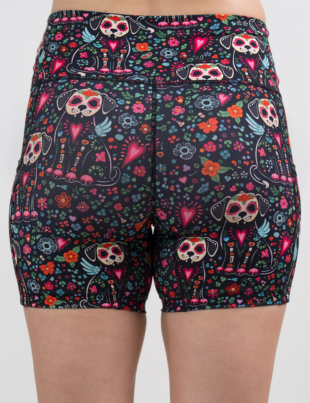 back of the skeleton dogs surrounded by flowers 5 inch shorts against a white background