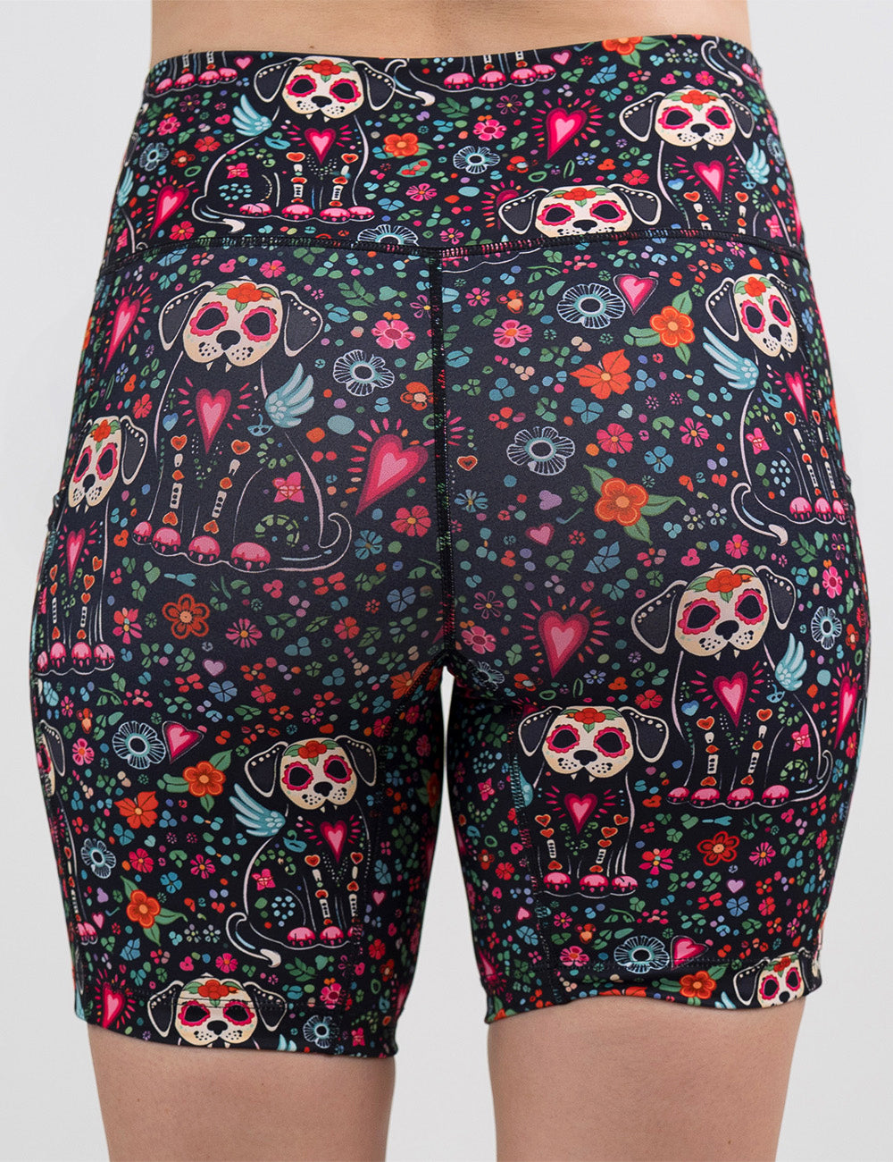 back of the skeleton dogs surrounded by flowers 7 inch shorts against a white background