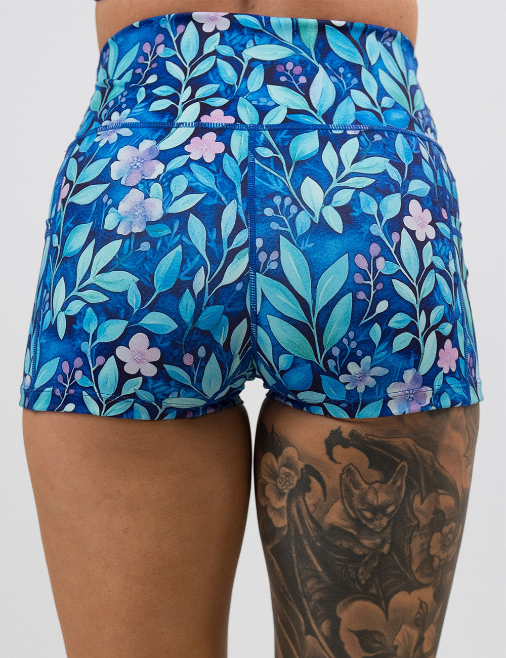 back of the 2.5 inch blue flowers and vines shorts against a white background