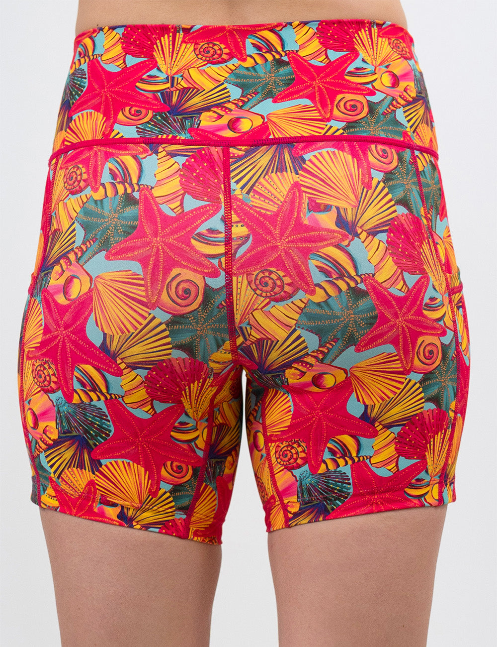 back of the 5 inch front of the red starfish with a yellow and blue shell background shorts against a white background