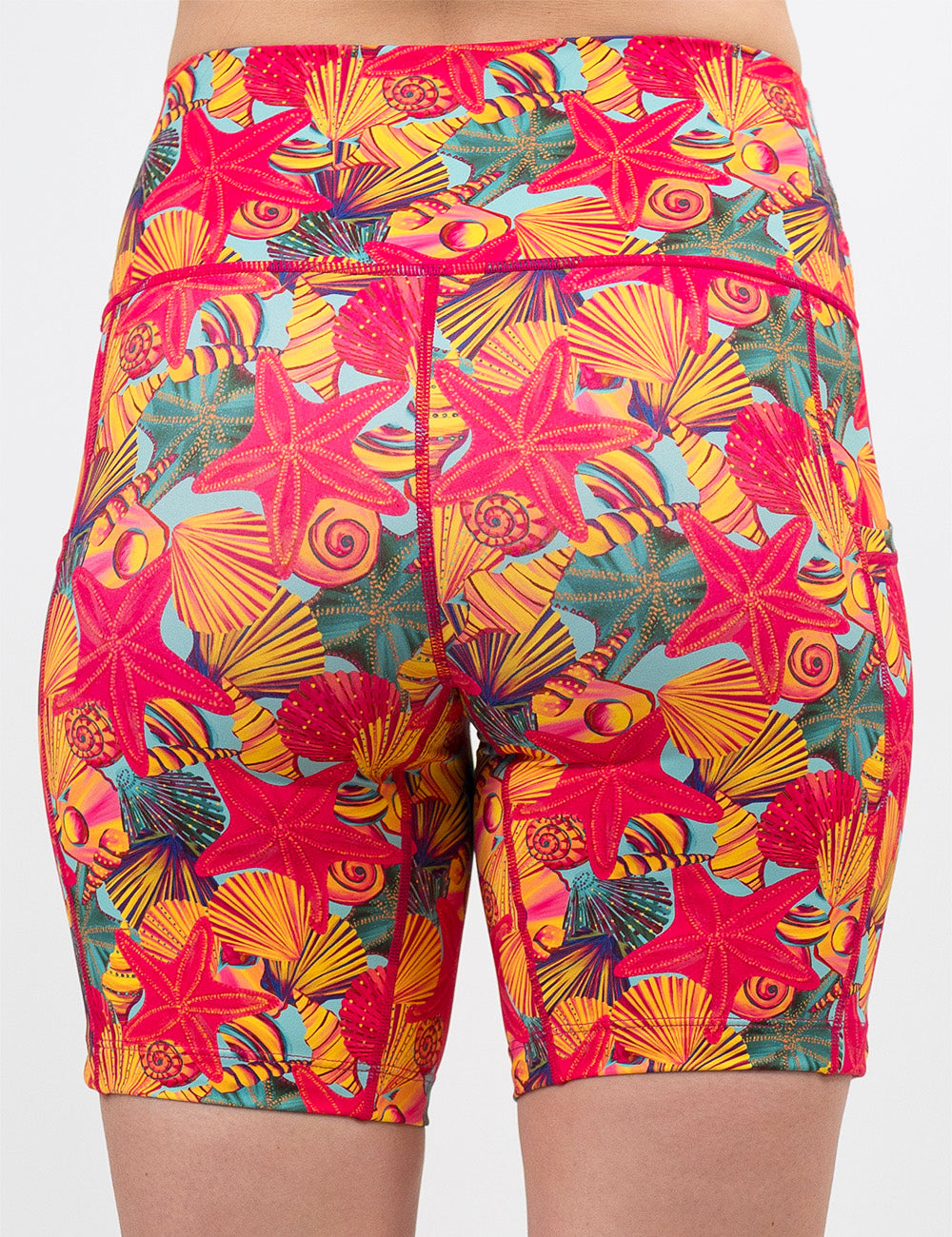 back of the 7 inch front of the red starfish with a yellow and blue shell background shorts against a white background
