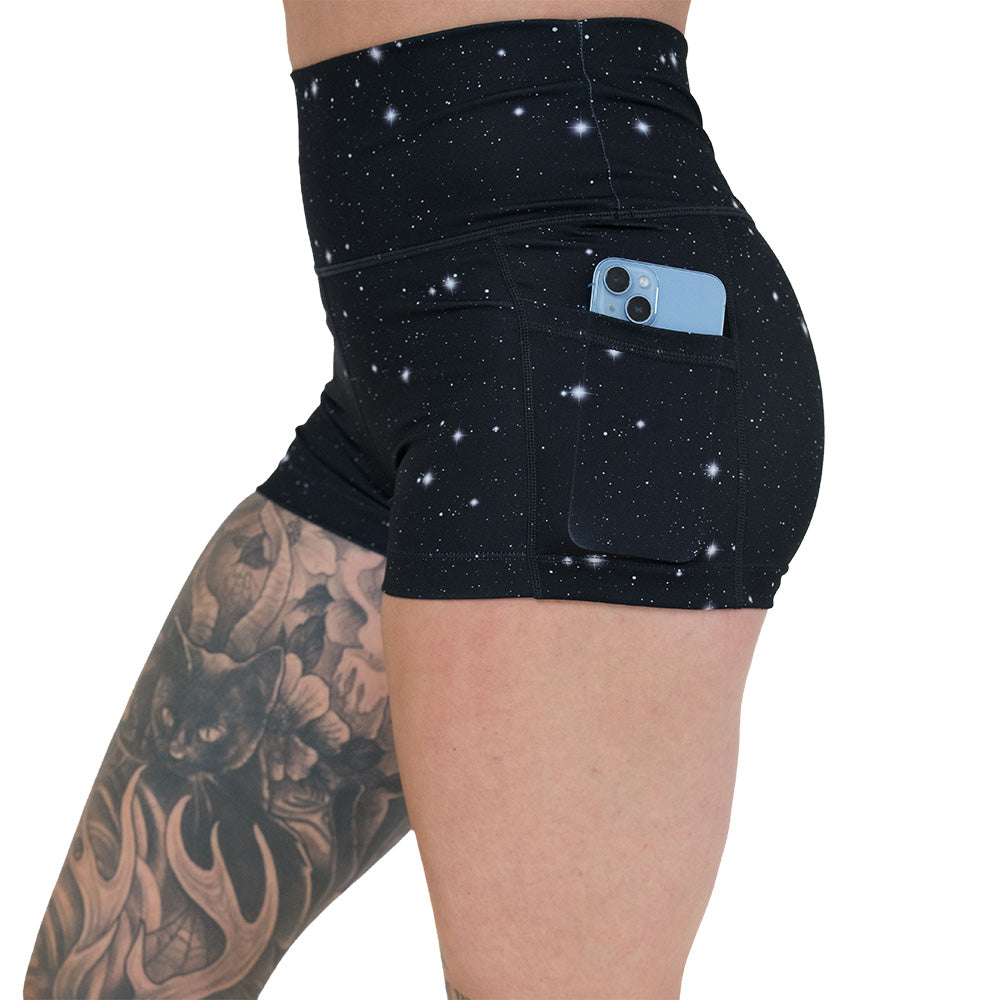 side pocket on the black shorts with a white star pattern on it