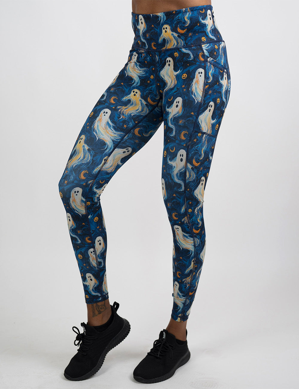 front of the starry night ghosts against a blue background pattern full length leggings against a white background